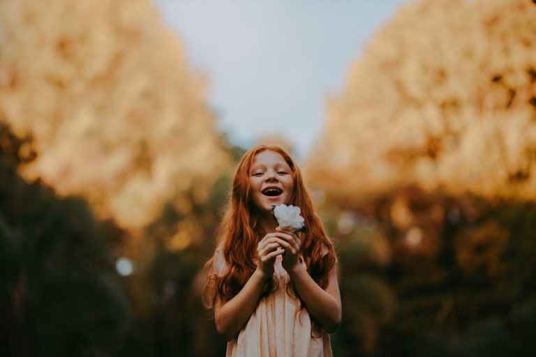 Child-with-flower-Where-Resiliency-Grows